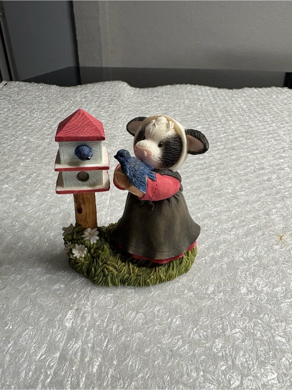 Enesco Mary's Moo Moos figurine titled "A Little Bird Told Moo